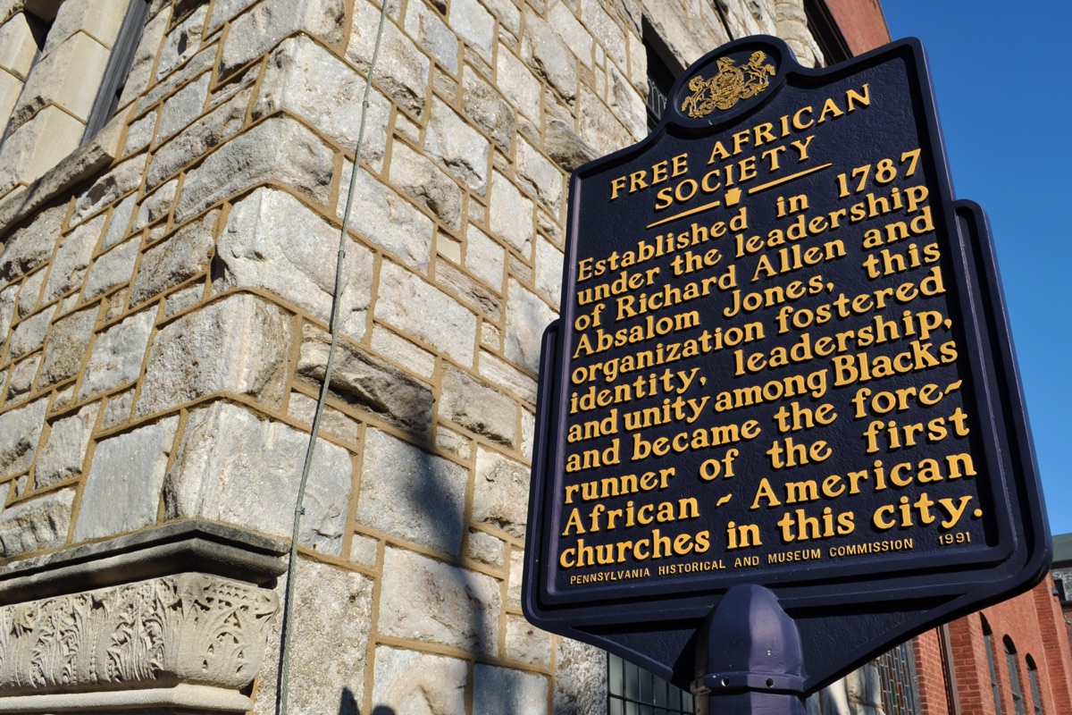 A historical marker on a Philadelphia street corner commemorating the Free African Society of 1787.