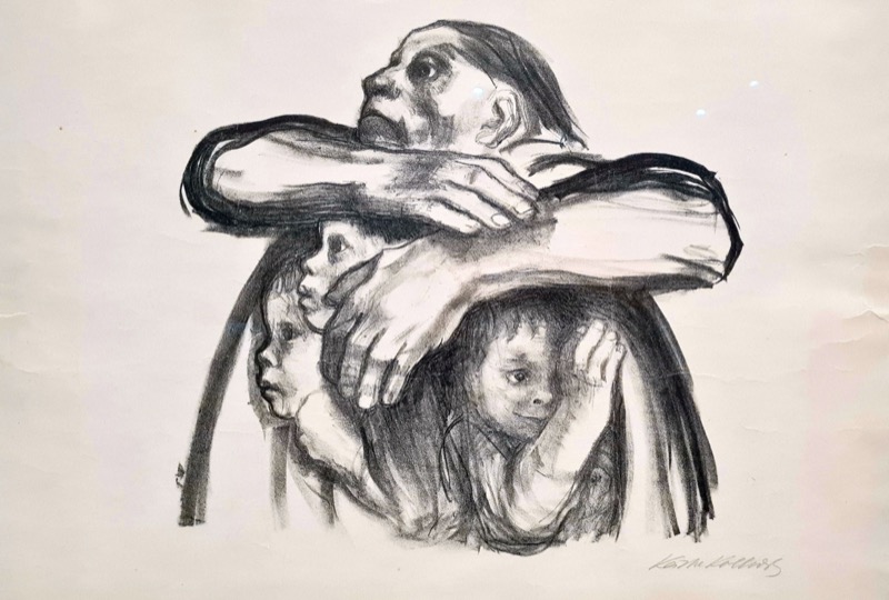 A mother shielding three children with her body, a chalk lithograph by Käthe Kollwitz titled Seed Corn Must Not Be Ground.